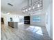 Spacious living area featuring luxury vinyl plank flooring, lots of light, and an open floor plan at 8600 Berkley Dr, Hudson, FL 34667
