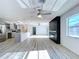 Open-concept living space offers updated kitchen, fireplace, and recessed lighting throughout the home at 8600 Berkley Dr, Hudson, FL 34667