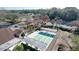 Aerial view of covered pickleball courts and lush landscaping in a residential community at 8600 Berkley Dr, Hudson, FL 34667