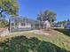View of the pool area surrounded by lawn at 8600 Berkley Dr, Hudson, FL 34667