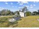 Backyard features picnic table, shed, and open yard at 11124 Corlett Rd, Riverview, FL 33578