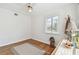 Bedroom featuring hardwood floors, decoratives, a ceiling fan, and a bright window at 11124 Corlett Rd, Riverview, FL 33578