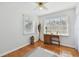Bedroom with hardwood floors, desk by bright windows and a ceiling fan at 11124 Corlett Rd, Riverview, FL 33578