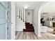 Entryway view with a staircase and arched entry to living room, displaying modern flooring at 11124 Corlett Rd, Riverview, FL 33578