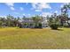Exterior view of the home with a large front yard at 11124 Corlett Rd, Riverview, FL 33578
