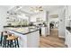 Stylish kitchen with a granite countertop island and bar stool seating, with an open floorplan at 11124 Corlett Rd, Riverview, FL 33578