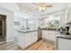 Bright, updated kitchen with island, granite countertops, stainless steel appliances, and natural light at 11124 Corlett Rd, Riverview, FL 33578