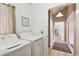Functional laundry area with washer, dryer, storage, and access to other parts of the home at 11124 Corlett Rd, Riverview, FL 33578
