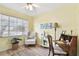 Home office with a large window, desk, and cozy chair for a productive workspace at 11124 Corlett Rd, Riverview, FL 33578