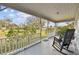 Front porch featuring rocking chairs and a view of the landscaped yard at 11124 Corlett Rd, Riverview, FL 33578