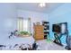 bedroom featuring a small bed, a wood dresser, and a small bookcase at 1168 Emerald Hill Way, Valrico, FL 33594