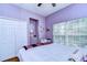 Bright bedroom with a large window and a built-in mirror at 1168 Emerald Hill Way, Valrico, FL 33594