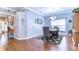 Open dining room area showcasing hardwood floors and elegant decor, perfect for Gathering gatherings at 1168 Emerald Hill Way, Valrico, FL 33594