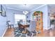 Formal dining room with stylish chairs, decorative rug, and a charming china cabinet at 1168 Emerald Hill Way, Valrico, FL 33594