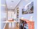 Light-filled foyer featuring hardwood floors and decorative wall art at 1168 Emerald Hill Way, Valrico, FL 33594