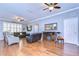 Inviting living room with hardwood floors, modern ceiling fans, and comfortable leather furniture at 1168 Emerald Hill Way, Valrico, FL 33594