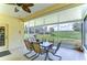 Enclosed patio featuring a table with seating and a gas grill at 1168 Emerald Hill Way, Valrico, FL 33594