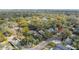 Aerial view showcases the neighborhood and surrounding greenery, providing a sense of community and natural beauty at 1209 E Idlewild Ave, Tampa, FL 33604