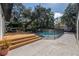 Backyard featuring a pool and deck area at 1209 E Idlewild Ave, Tampa, FL 33604