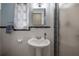 Bathroom featuring pedestal sink, white tile and a tiled shower at 1209 E Idlewild Ave, Tampa, FL 33604