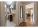 View from hallway to a cozy bathroom featuring a dark vanity at 1209 E Idlewild Ave, Tampa, FL 33604