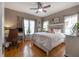 Bedroom featuring wood floors, neutral walls and a ceiling fan at 1209 E Idlewild Ave, Tampa, FL 33604