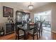 Elegant dining room with hardwood floors and a sophisticated display cabinet at 1209 E Idlewild Ave, Tampa, FL 33604