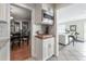 Kitchen area with stainless microwave, wood butcher block and connection to dining and living rooms at 1209 E Idlewild Ave, Tampa, FL 33604