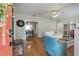 Bright and spacious living room featuring wood floors, a ceiling fan, and an open layout at 1209 E Idlewild Ave, Tampa, FL 33604