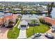 Aerial view of waterfront property, mature landscaping, private dock, and pristine curb appeal at 1324 51St Ne Ave, St Petersburg, FL 33703