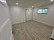 Bedroom featuring wood-look tile floors, a double-door closet, and natural light from a window at 1324 51St Ne Ave, St Petersburg, FL 33703