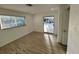 Bright bedroom features neutral colors, light-colored floors, and a sliding glass door at 1324 51St Ne Ave, St Petersburg, FL 33703