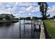 Waterfront property featuring a private dock and boat lift, perfect for boating enthusiasts at 1324 51St Ne Ave, St Petersburg, FL 33703