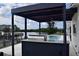 Outdoor grilling area with a canopy and a view of the pool and waterway at 1324 51St Ne Ave, St Petersburg, FL 33703