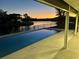 The backyard has a screened in swimming pool with a view of the waterfront at 1324 51St Ne Ave, St Petersburg, FL 33703