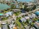 An aerial view showing the home's proximity to the bay, beaches, and beautiful landscaping at 15548 1St E St, Redington Beach, FL 33708