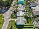 An aerial view showing the home's proximity to the bay, beaches, and beautiful landscaping at 15548 1St E St, Redington Beach, FL 33708