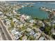 An aerial view showing the home's proximity to the bay, beaches, and beautiful landscaping at 15548 1St E St, Redington Beach, FL 33708