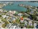 An aerial view showing the home's proximity to the bay, beaches, and beautiful landscaping at 15548 1St E St, Redington Beach, FL 33708