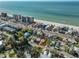 Aerial view of a beach area featuring a coastal home near the waterfront, offering access to the beach at 15548 1St E St, Redington Beach, FL 33708