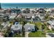 A cozy coastal home with a fenced yard and peek of the ocean view at 15548 1St E St, Redington Beach, FL 33708