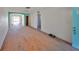 Living room featuring hardwood floors and an arched doorway at 15548 1St E St, Redington Beach, FL 33708