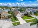 An aerial view of a neighborhood showcasing mature trees, green lawns, and diverse home styles at 1609 Shady Oaks Dr, Oldsmar, FL 34677