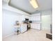 Bright and clean kitchen featuring white cabinetry, stainless steel appliances, and tile floors at 1609 Shady Oaks Dr, Oldsmar, FL 34677