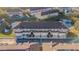 Aerial view of a well maintained complex with ample parking and green spaces at 18012 Melibee Stone St, Tampa, FL 33647