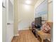 Cozy hallway nook with two chairs and a TV, creating a welcoming and functional space at 18012 Melibee Stone St, Tampa, FL 33647