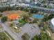 Aerial view of the community recreational area, featuring a baseball field, tennis courts, and playground at 219 126Th Ave, Treasure Island, FL 33706