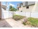 A fenced backyard features a brick patio, perfect for outdoor entertaining and relaxation at 219 126Th Ave, Treasure Island, FL 33706