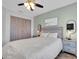 The bedroom boasts a light green painted wall and a neutral beach painting above the bed at 219 126Th Ave, Treasure Island, FL 33706