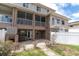 Townhouse exterior with balconies, patio, and outdoor space at 219 126Th Ave, Treasure Island, FL 33706